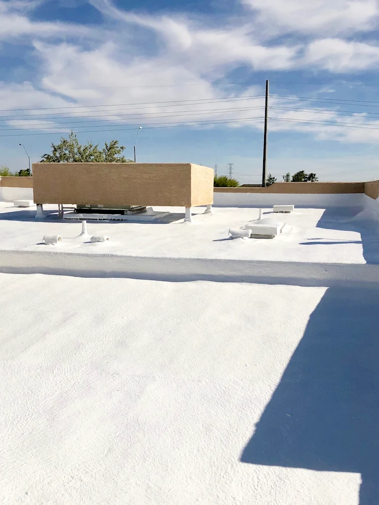 Commercial flat roof with white elastomeric coating